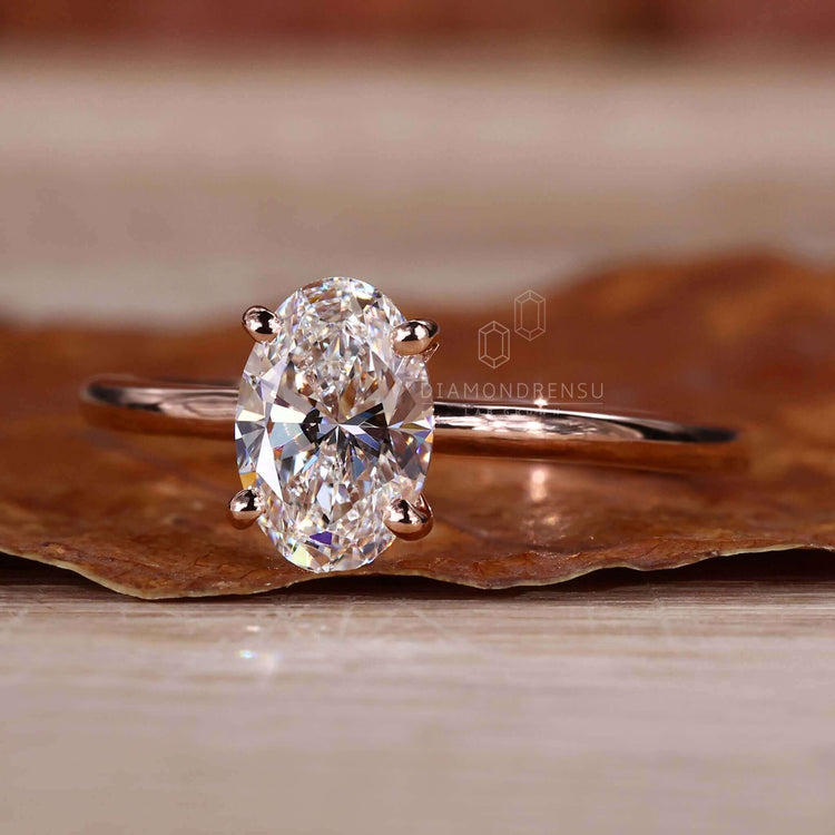 Oval cut diamond ring with a solitaire design, made for modern women.
