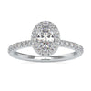 Oval diamond engagement ring in white gold with round prong setting.