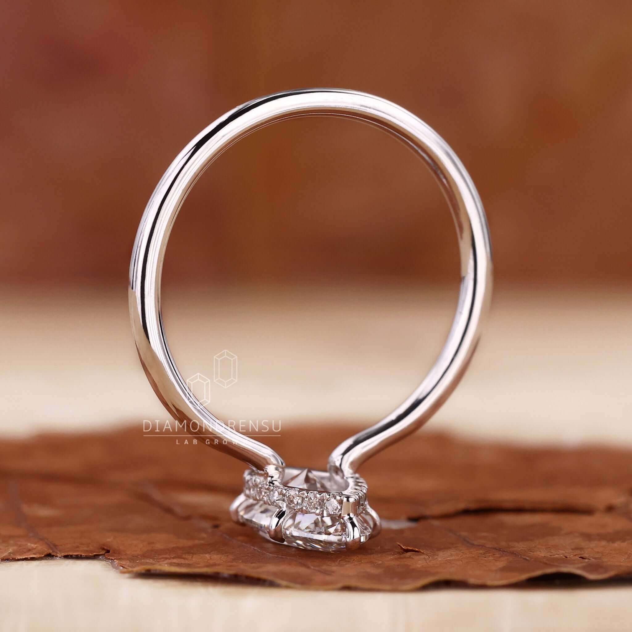 Modern hidden halo engagement ring, ideal for a special proposal.