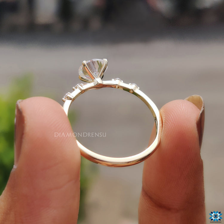 UK engagement ring with 1 carat moissanite and distance pave detailing.