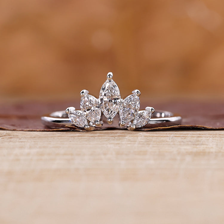 Marquise diamond wedding band designed in a curved tiara shape.
