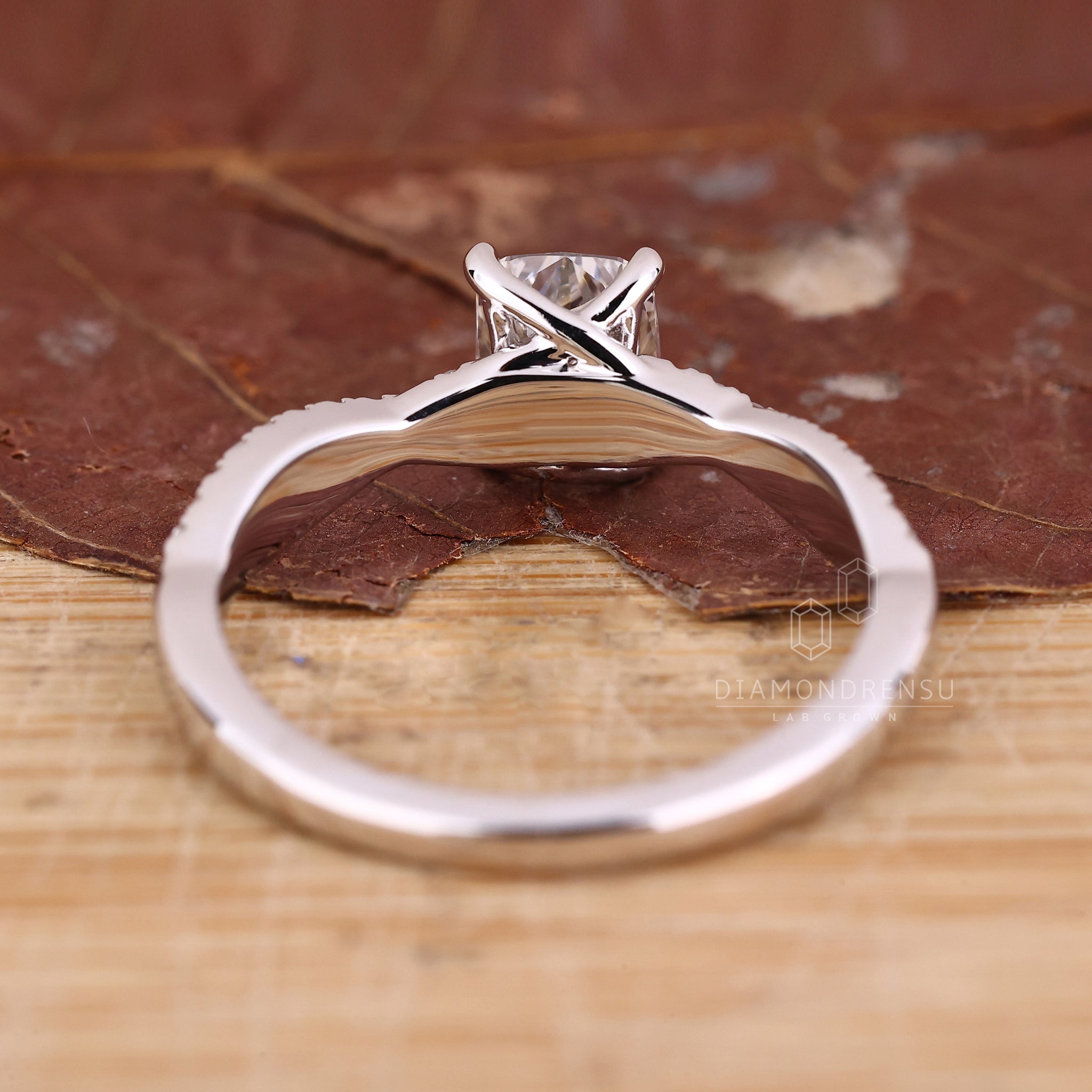 Unique engagement ring with twisted pave setting