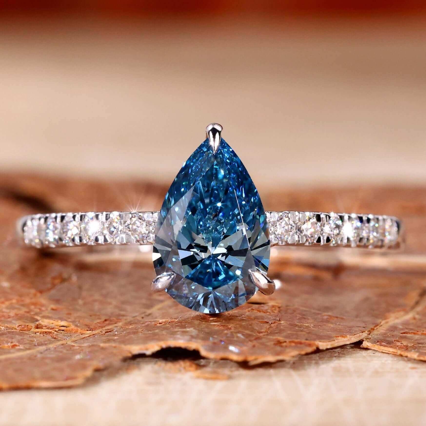 Blue stone ring with a pear-shaped design, perfect for elegant UK engagement styles.