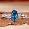 Blue stone ring with a pear-shaped design, perfect for elegant UK engagement styles.
