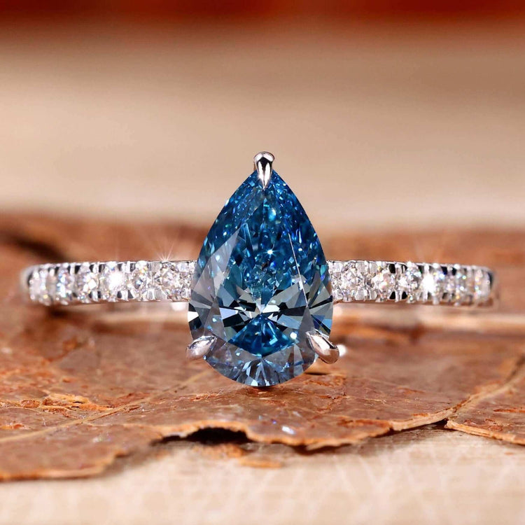 Blue stone ring with a pear-shaped design, perfect for elegant UK engagement styles.