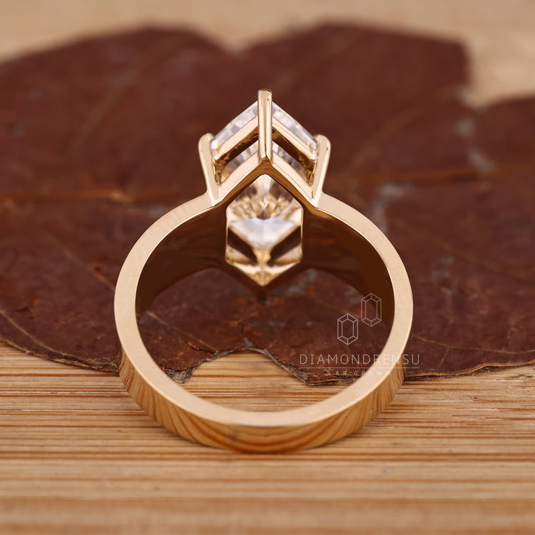 Solitaire marquise diamond ring with tapered shank band