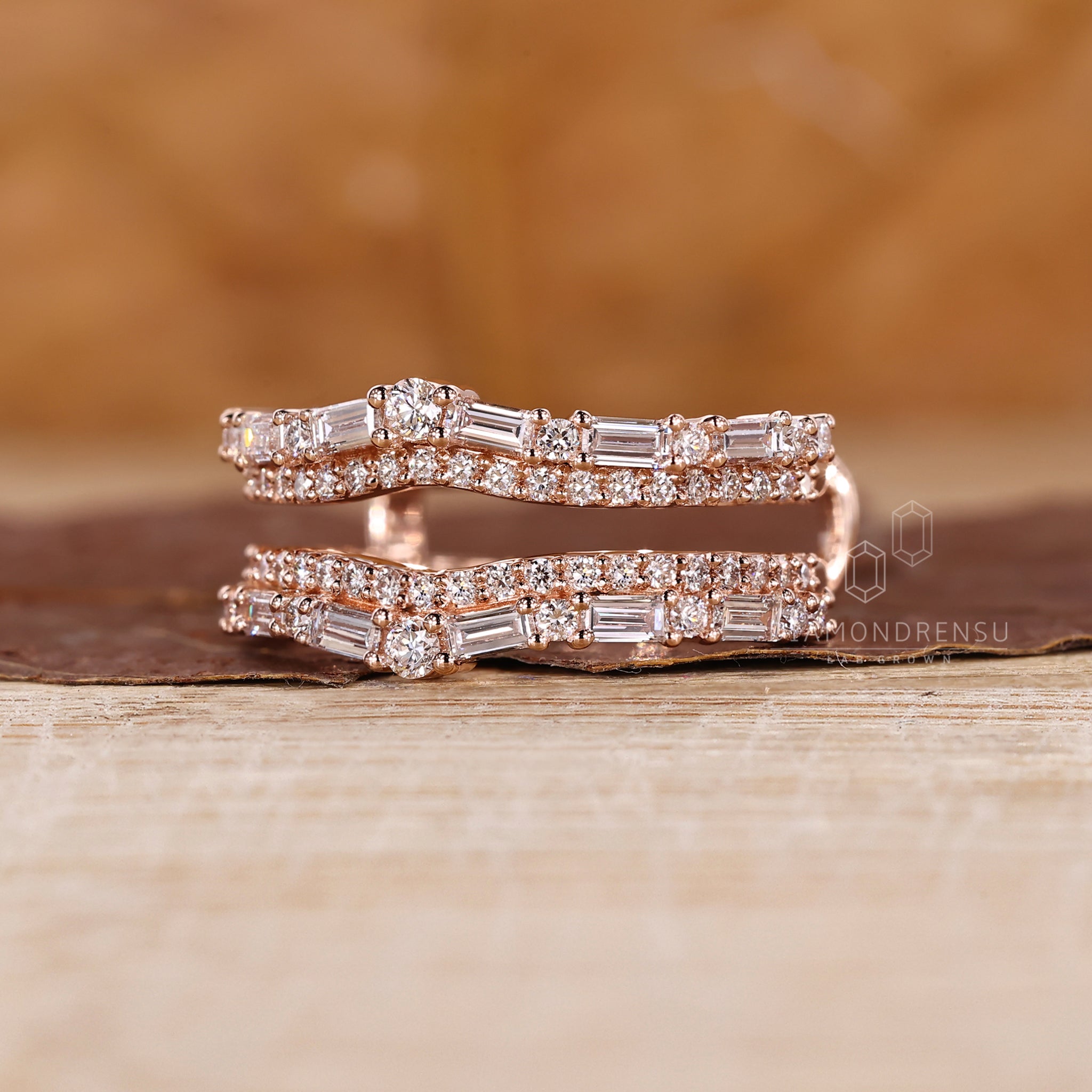 Rose gold wedding band with curved double row design.