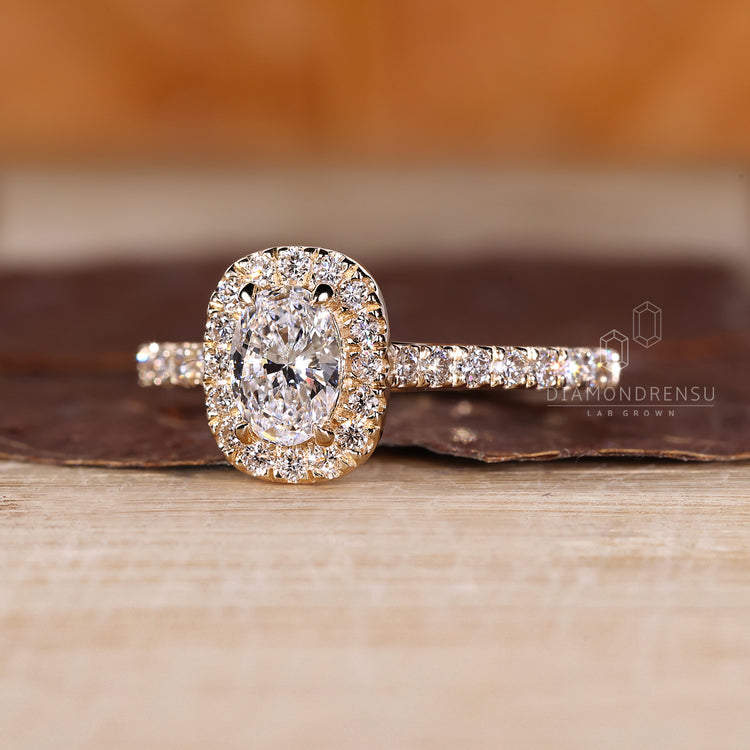 Halo diamond ring in a cathedral style setting.