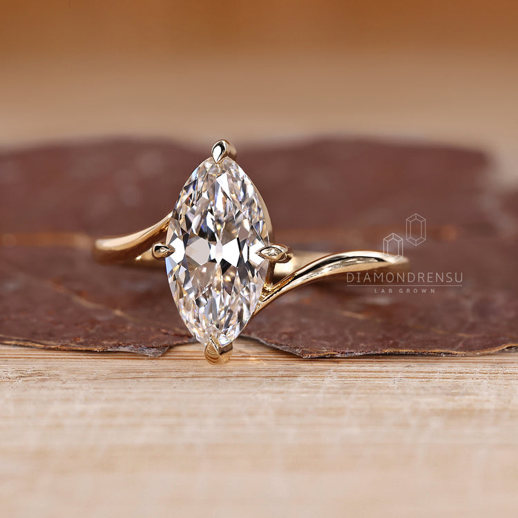 Lab grown marquise old european cut diamond ring with bypass setting.