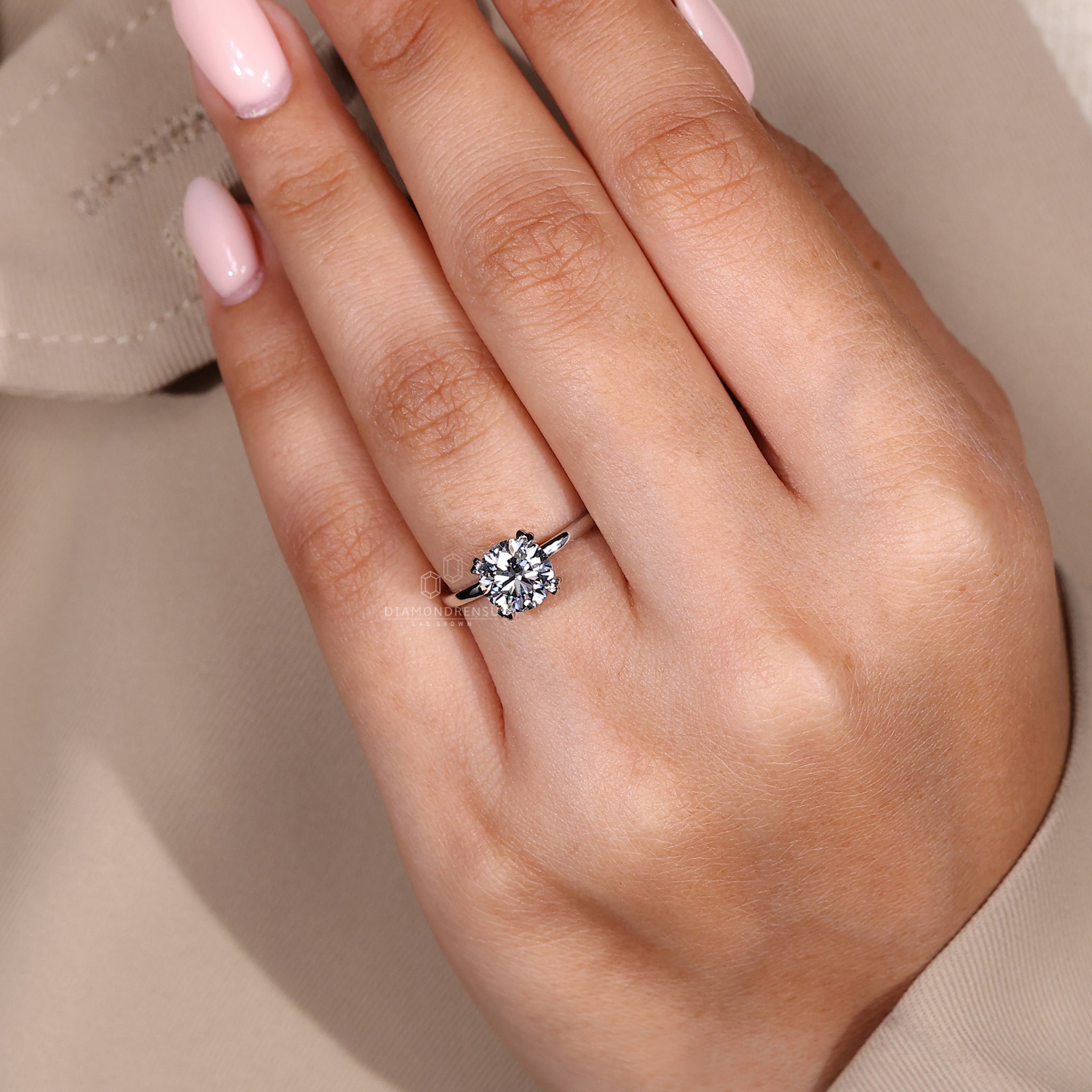 Custom engagement ring made in double claw prong setting.