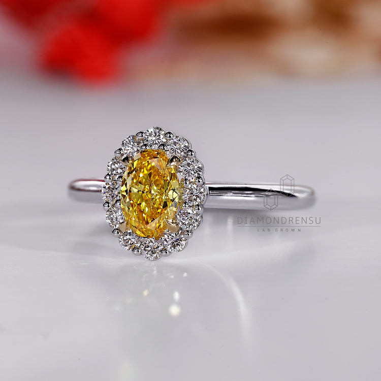 Halo engagement ring with white gold finish.