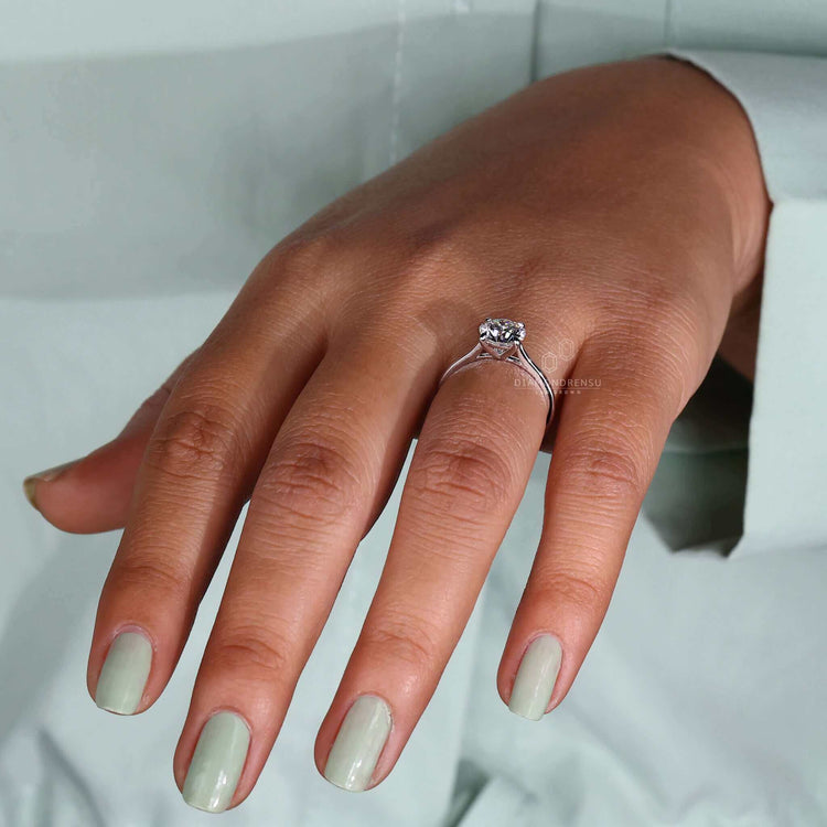 Round cut diamond ring in a claw prong setting, designed as a beautiful handmade jewellery piece for proposals.