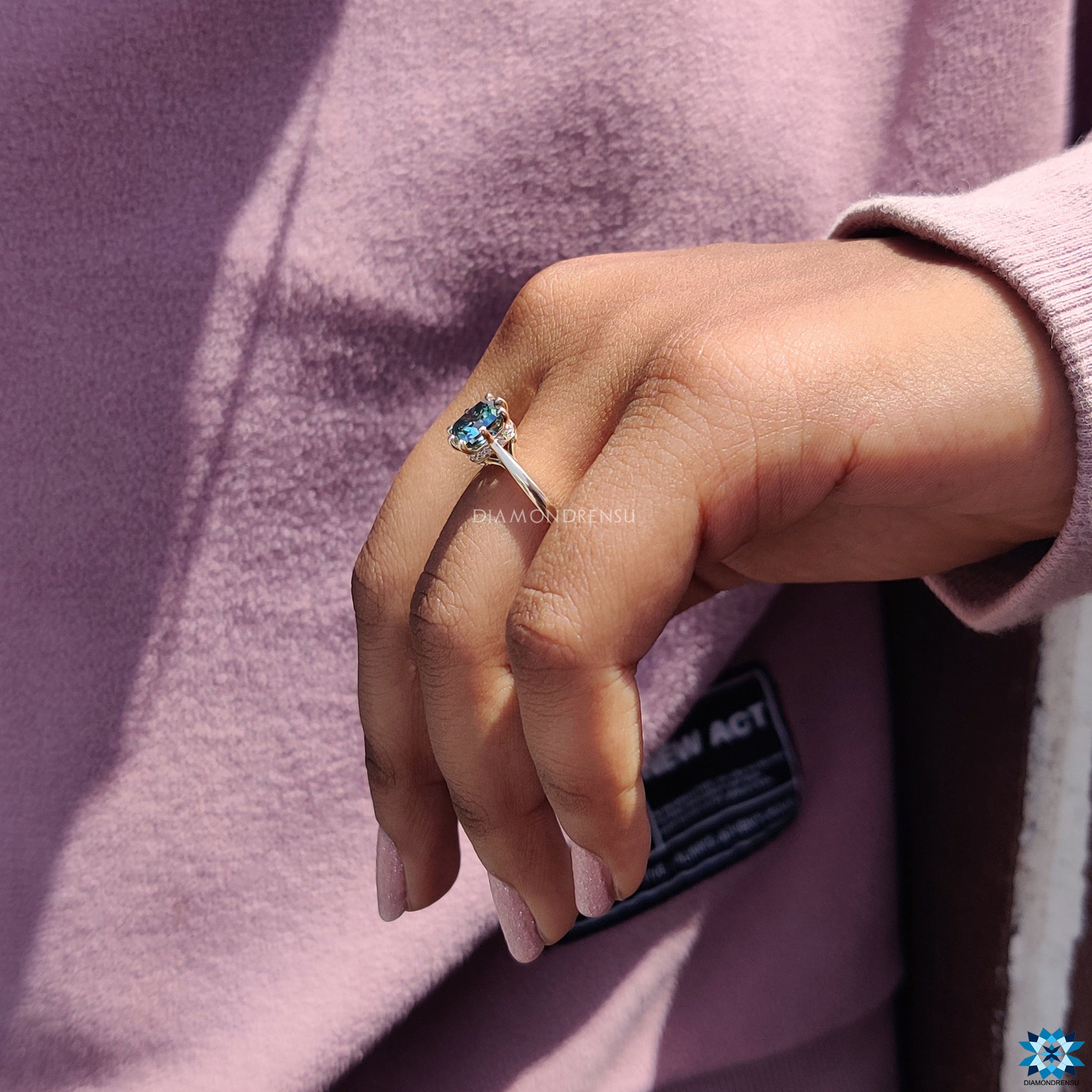 Yellow gold ring featuring cushion cut moissanite with hidden halo design.