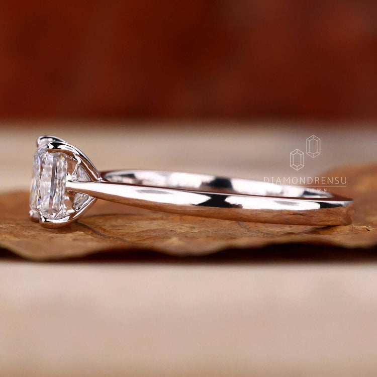 White gold solitaire ring with a unique cathedral setting.