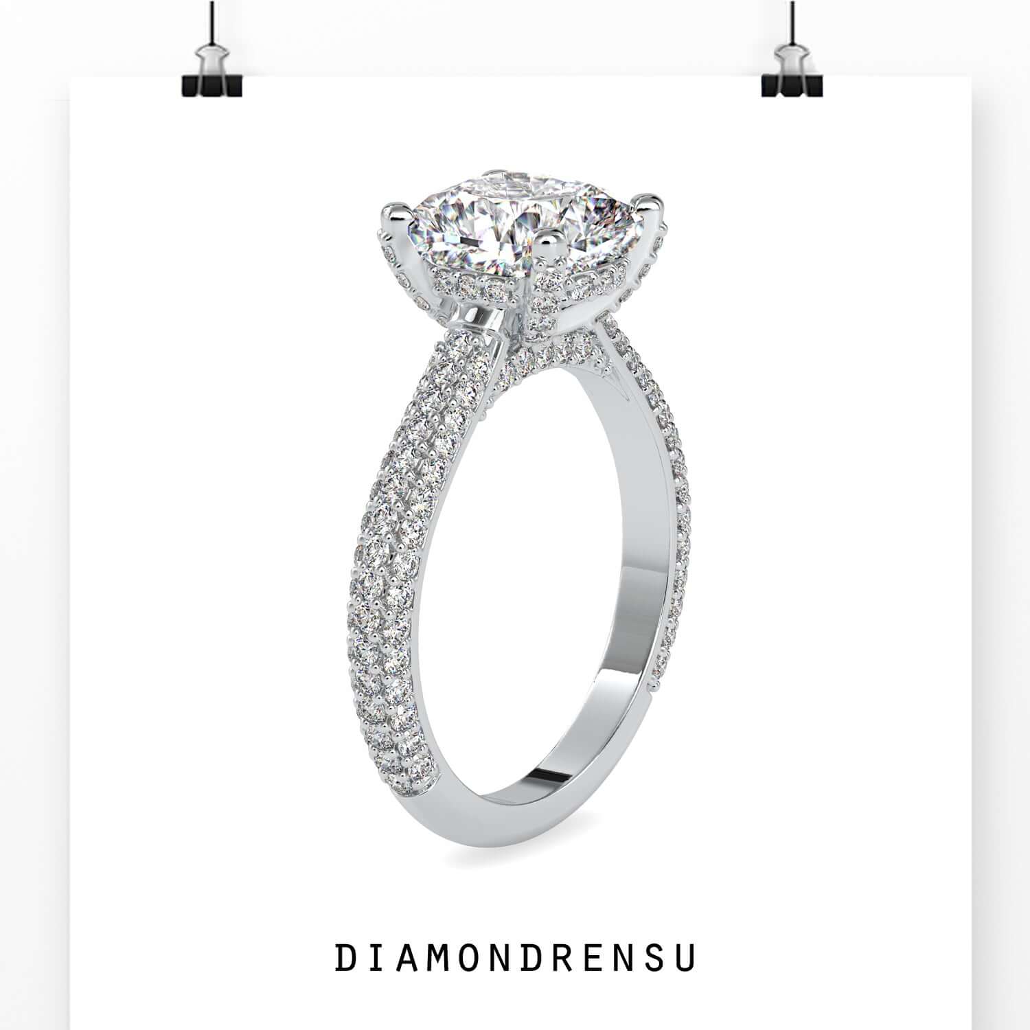 White gold ring featuring cushion cut and pave detail.