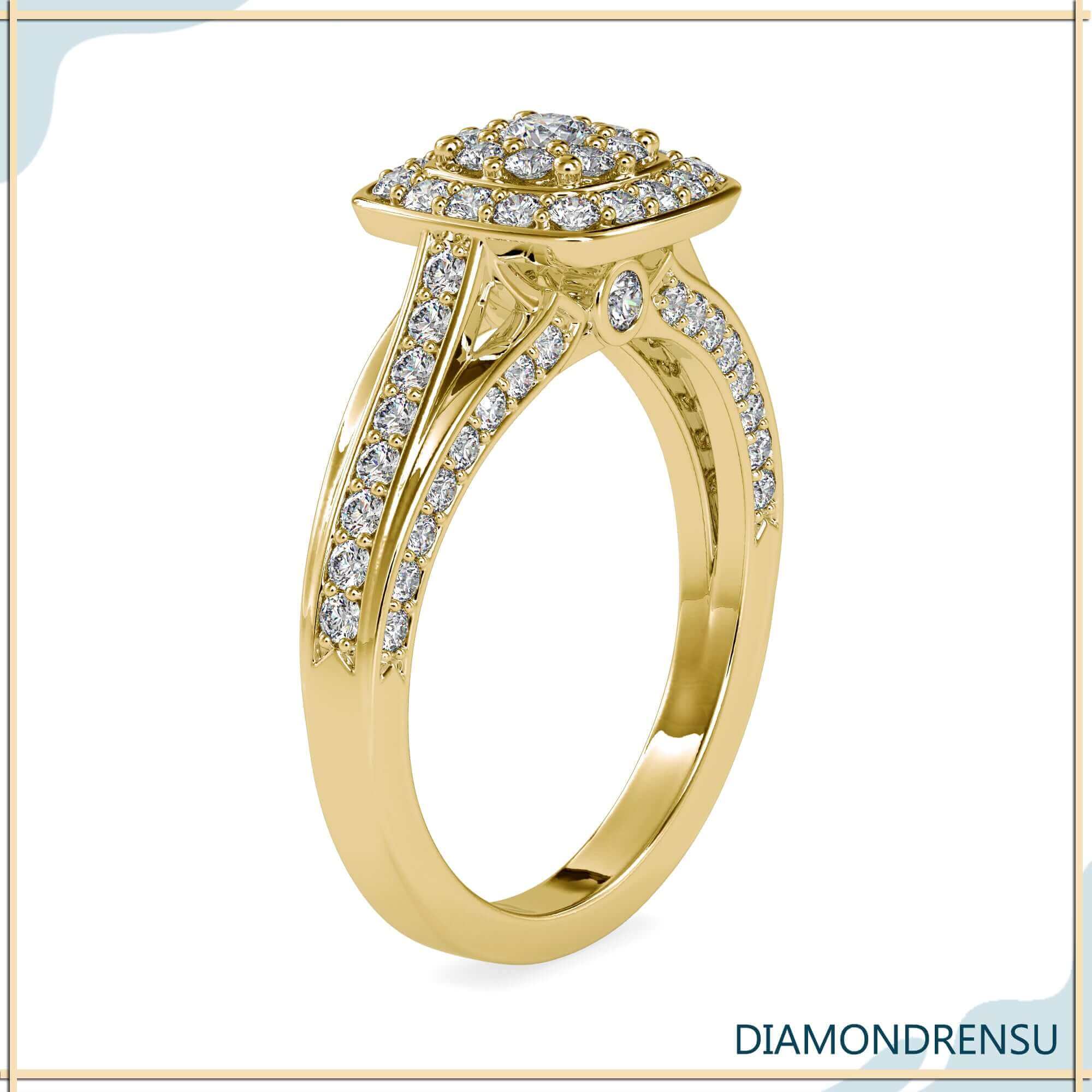 Custom engagement ring with split shank and pave band.