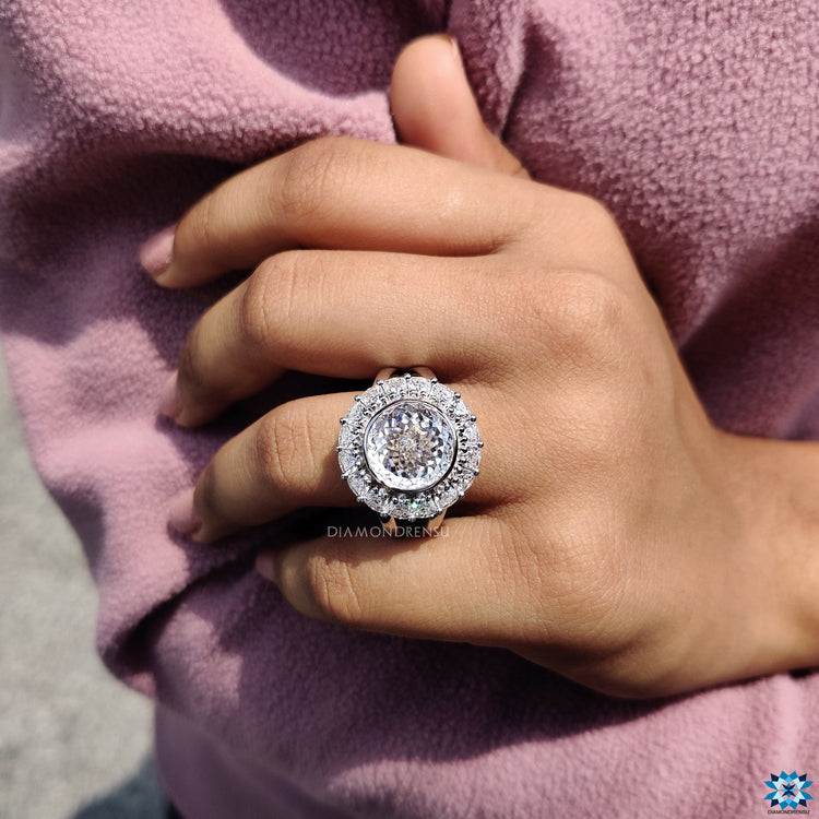 Trillion cut halo in vintage ring with round prong moissanite.