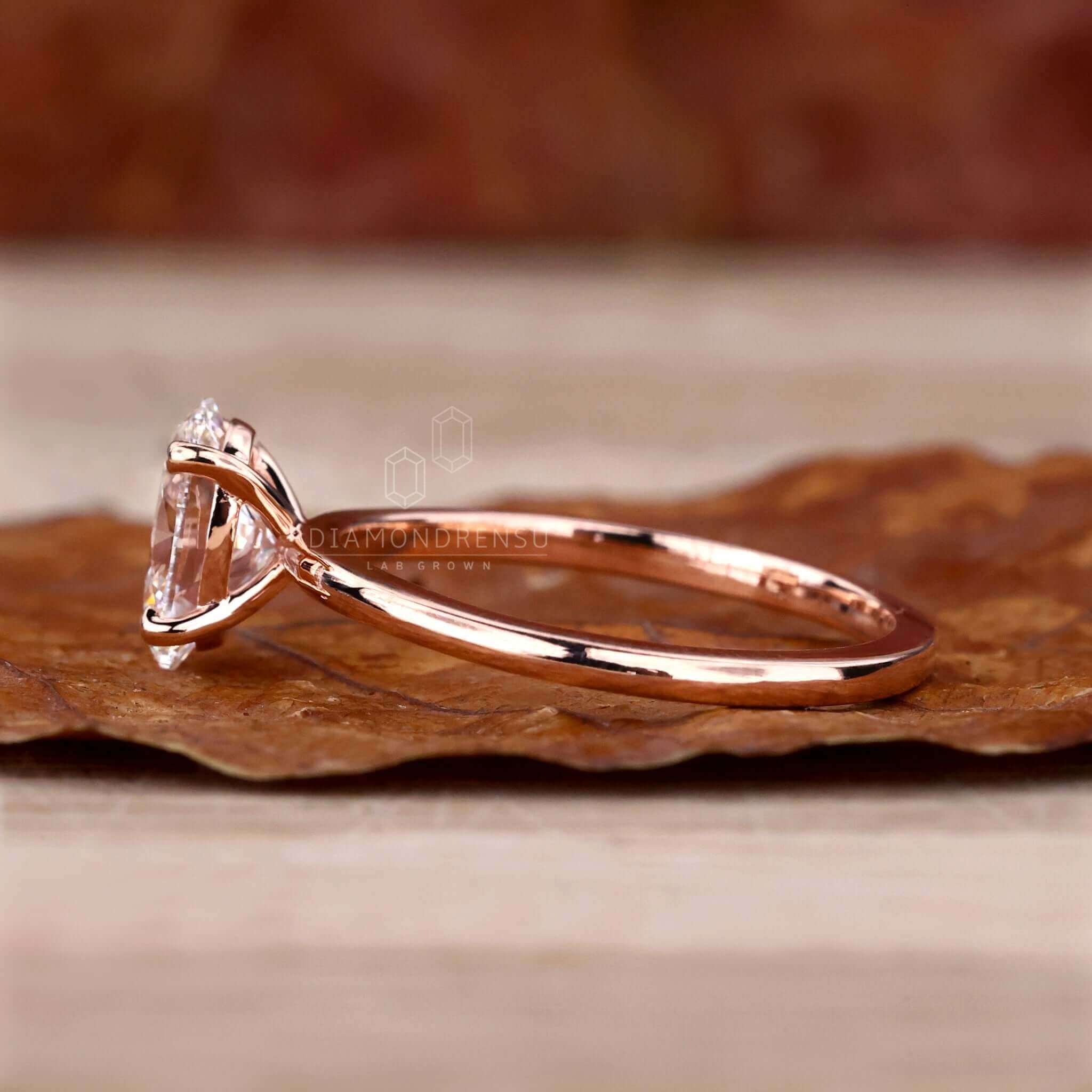 Solitaire oval diamond ring with a prong setting, crafted for special occasions.