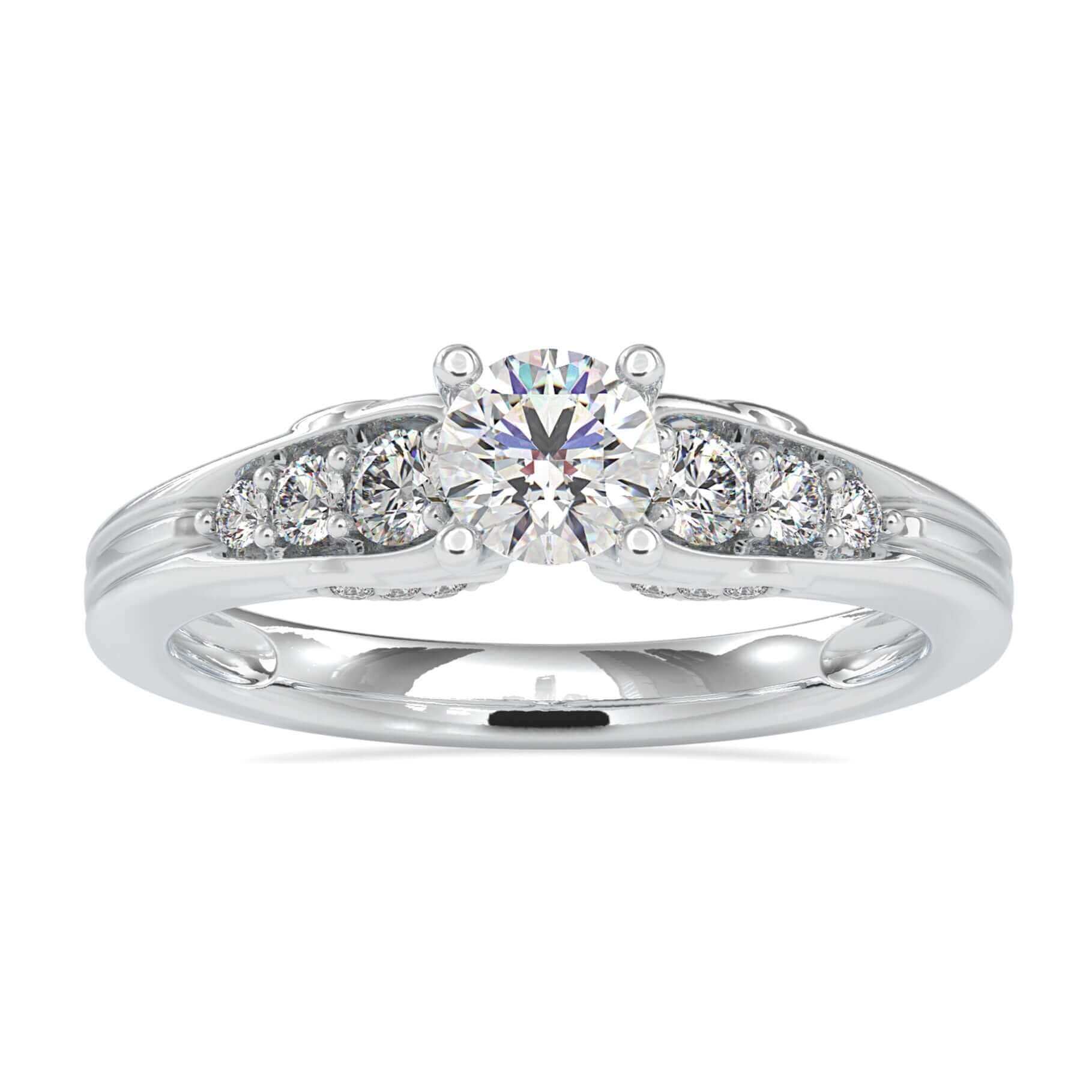 Brilliant cut diamond ring with tapered band and 7 round stones.