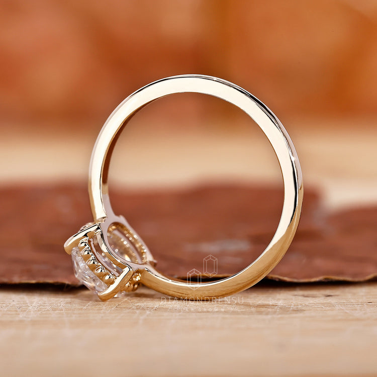 Milgrain setting ring on oval cut diamond ring