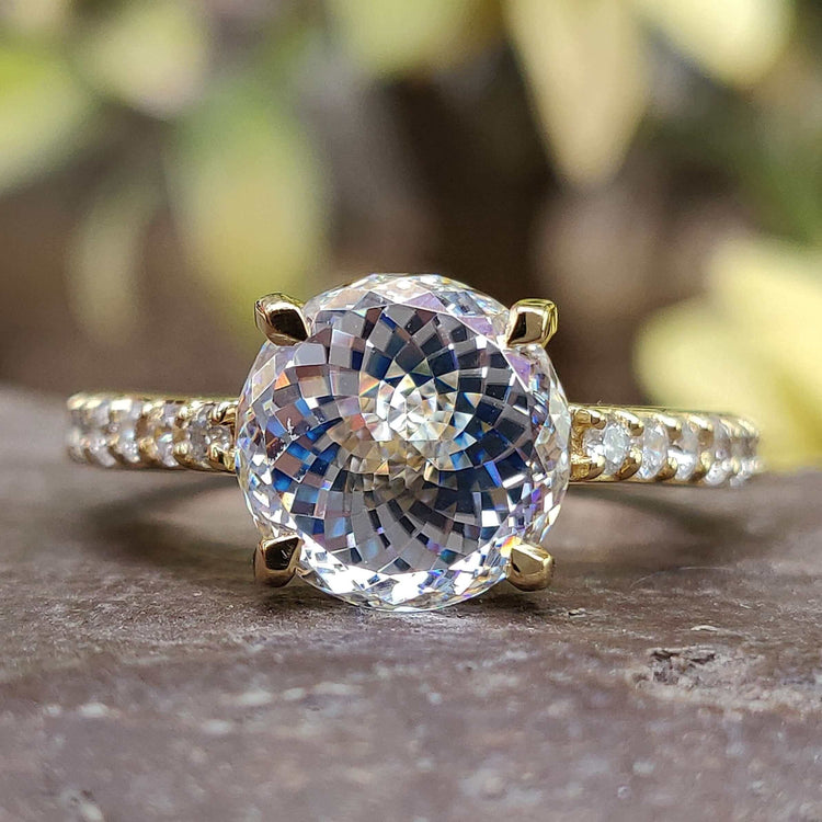 Portuguese cut moissanite ring in yellow gold.