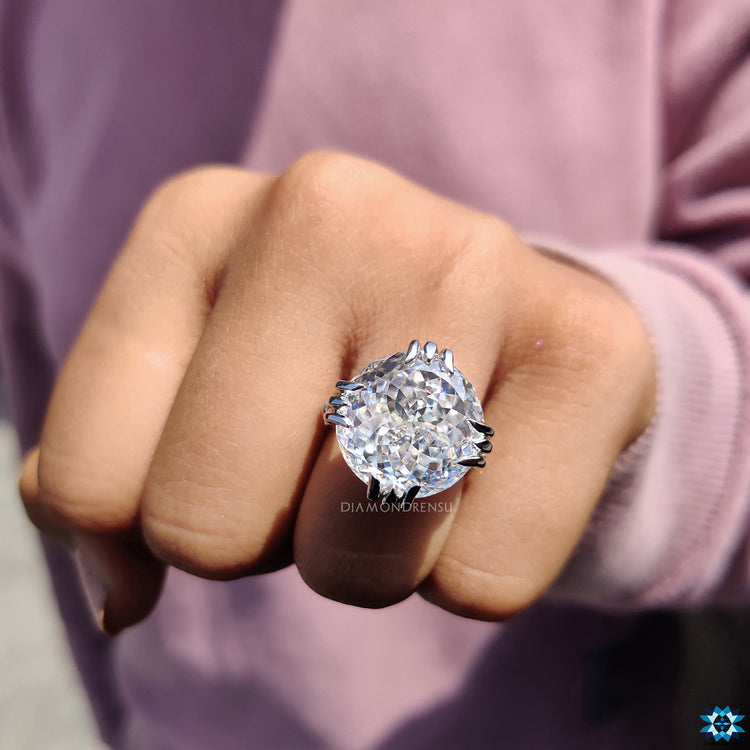 White gold ring with vintage milgrain touches and round moissanite accents.