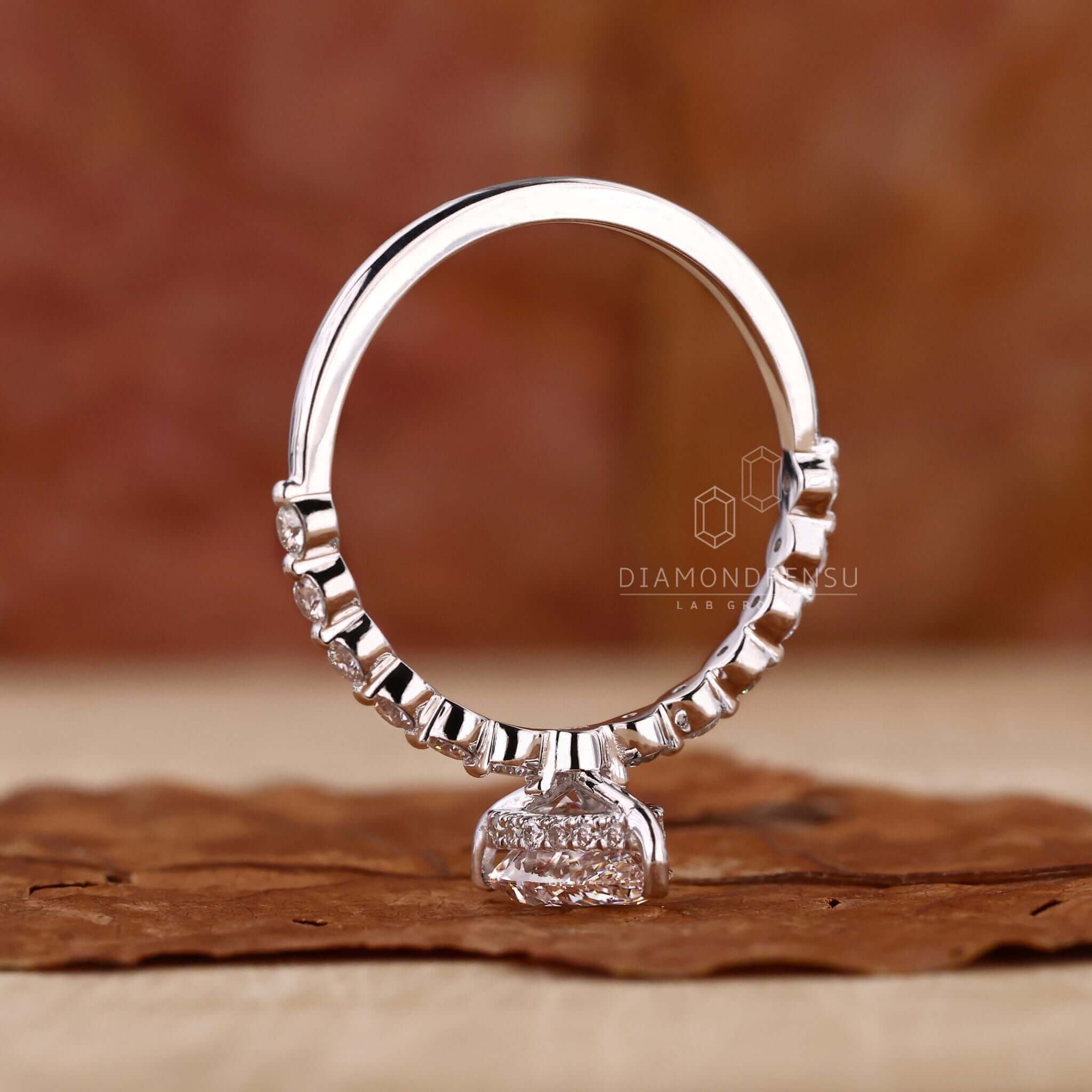 Round diamond engagement ring with a hidden halo setting for a unique touch of sparkle.