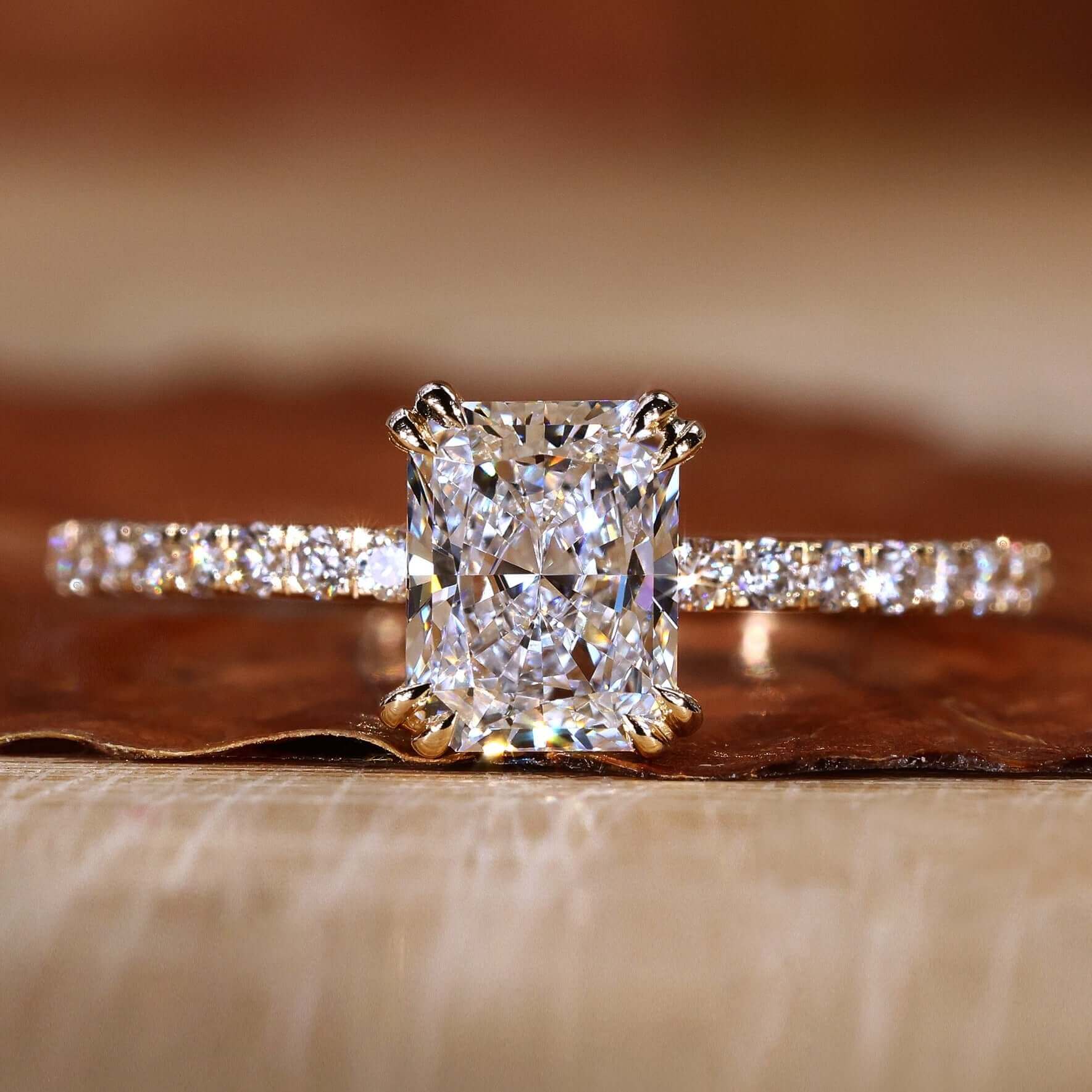 Radiant engagement ring with claw prong setting for elegance.