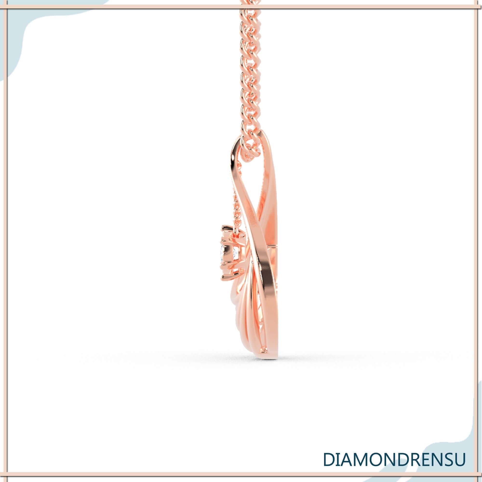White gold teardrop pendant with unique sunburst diamond halo.