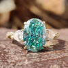 A twisted band engagement ring with a cyan blue moissanite center stone by Diamondrensu UK.