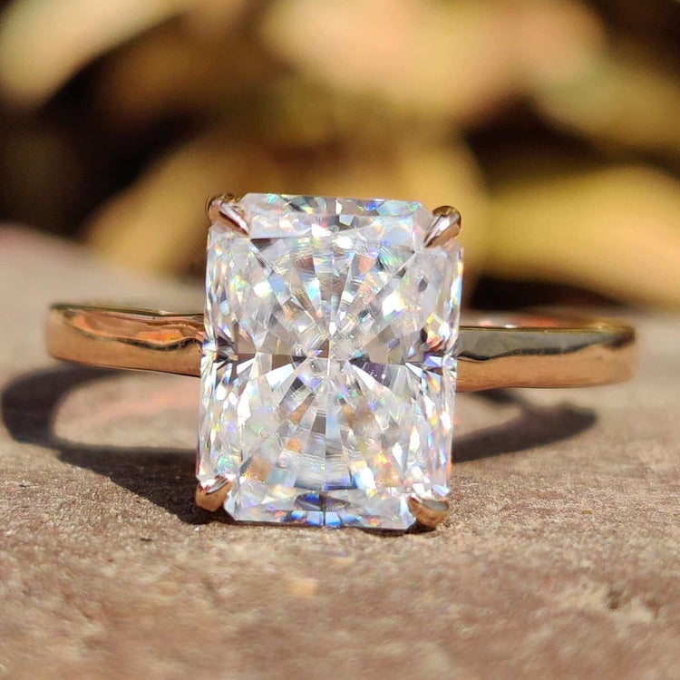 Radiant cut moissanite solitaire engagement ring.