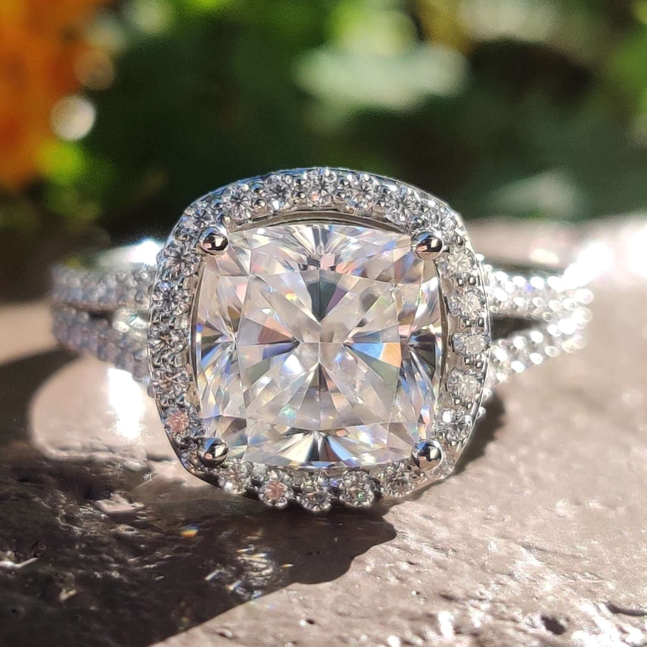 Cushion cut moissanite engagement ring in white gold.