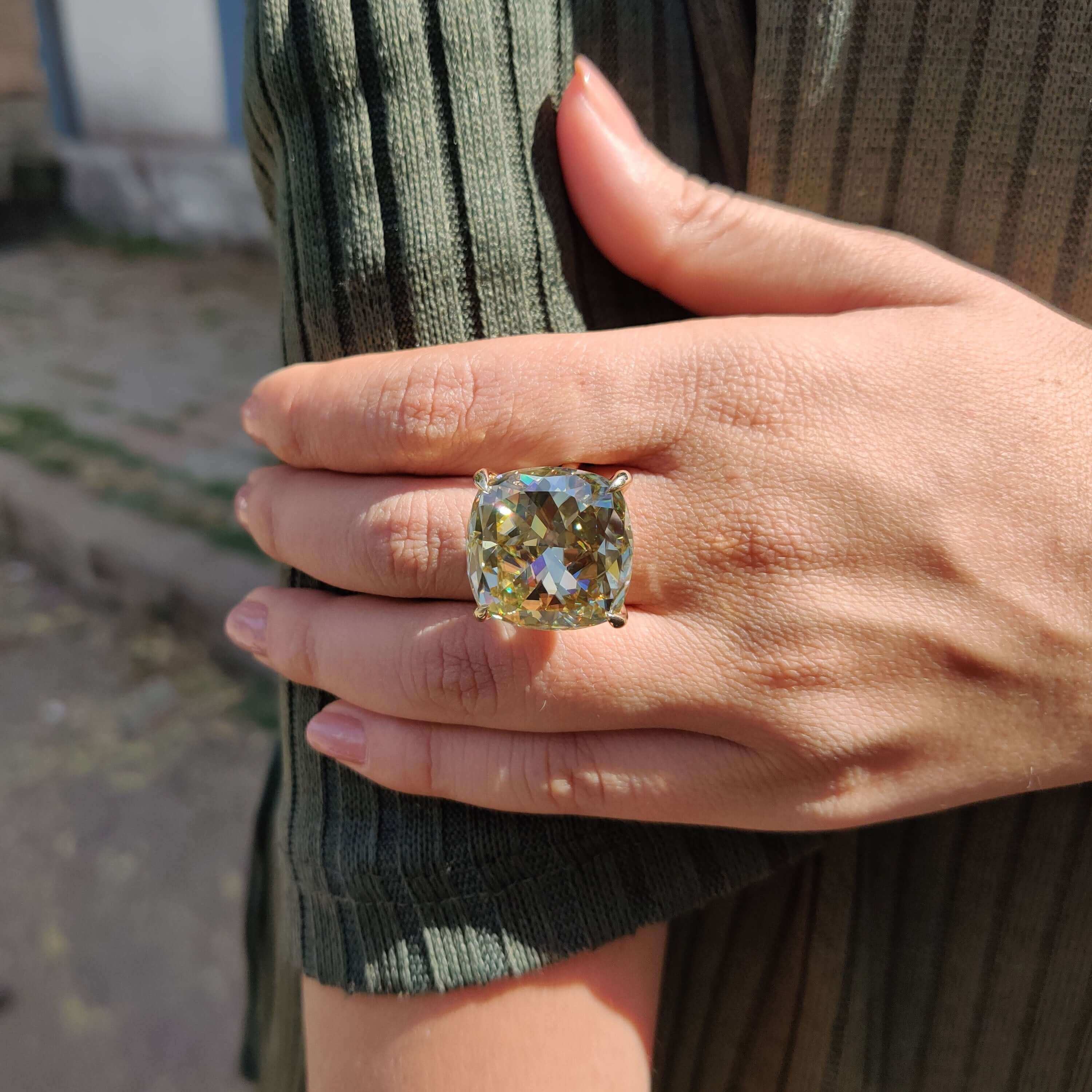 Handmade cushion cut engagement ring in yellow gold.