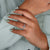 Sparkling round brilliant cut diamond set in a modern band. Sparkling round brilliant cut diamond set in a modern band.