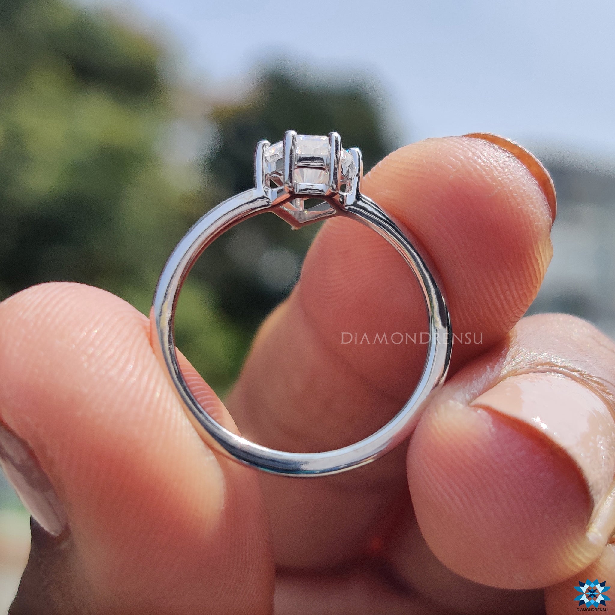 Handmade ring with spear cut moissanite set in a secure prong setting.