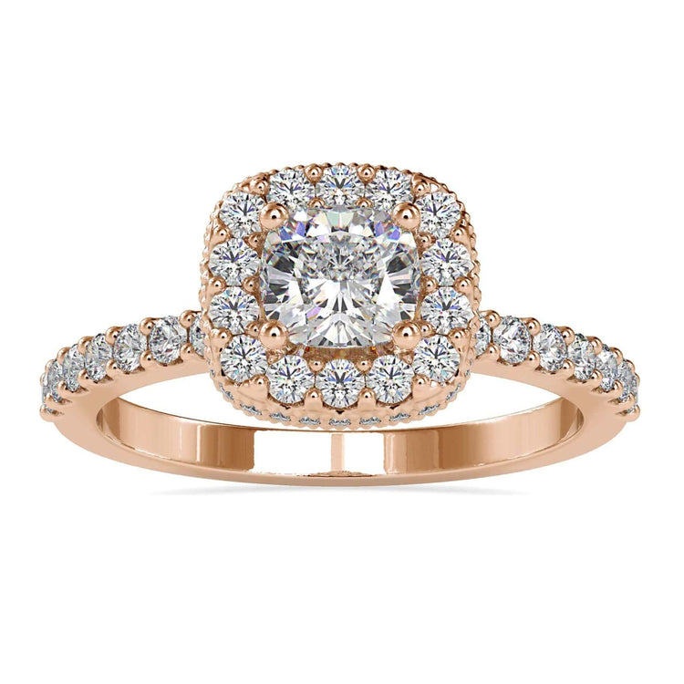 Cushion diamond ring with hidden halo in rose gold setting.