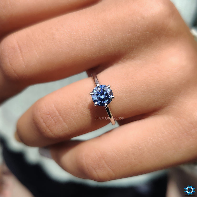 White gold moissanite ring with solitaire styling and handmade detail.