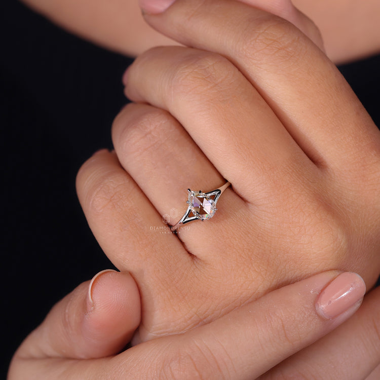 Pear diamond ring is placed in the center with prong setting.