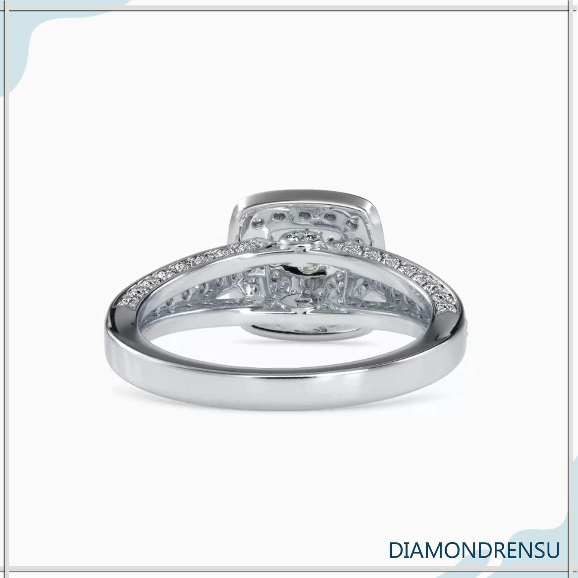 Rose gold diamond ring with bezel set and double halo.