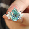 Moissanite pear engagement ring in white gold.