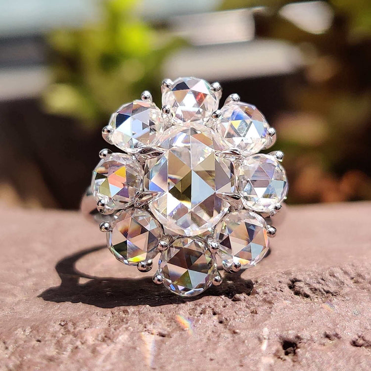 Oval rose cut moissanite engagement ring in white gold.