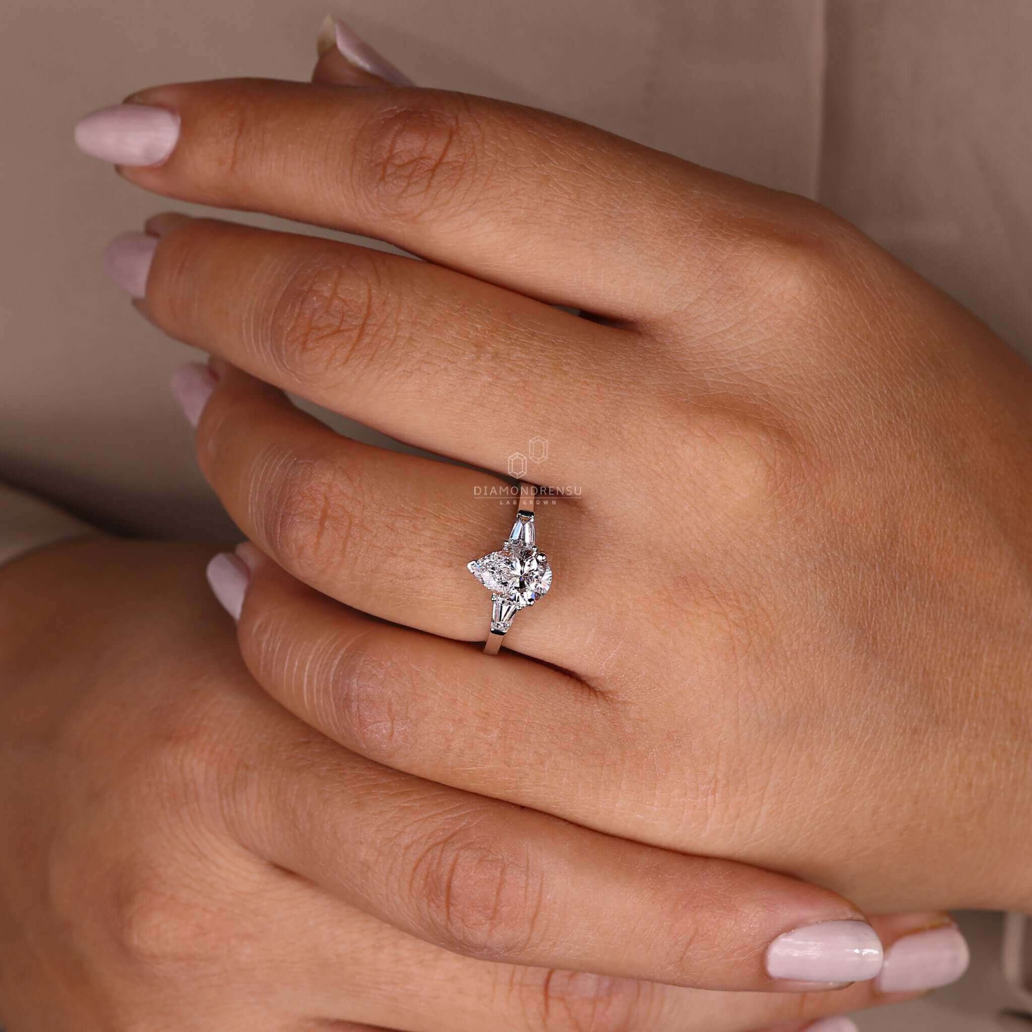 Unique three stone diamond engagement ring with exquisite detail.