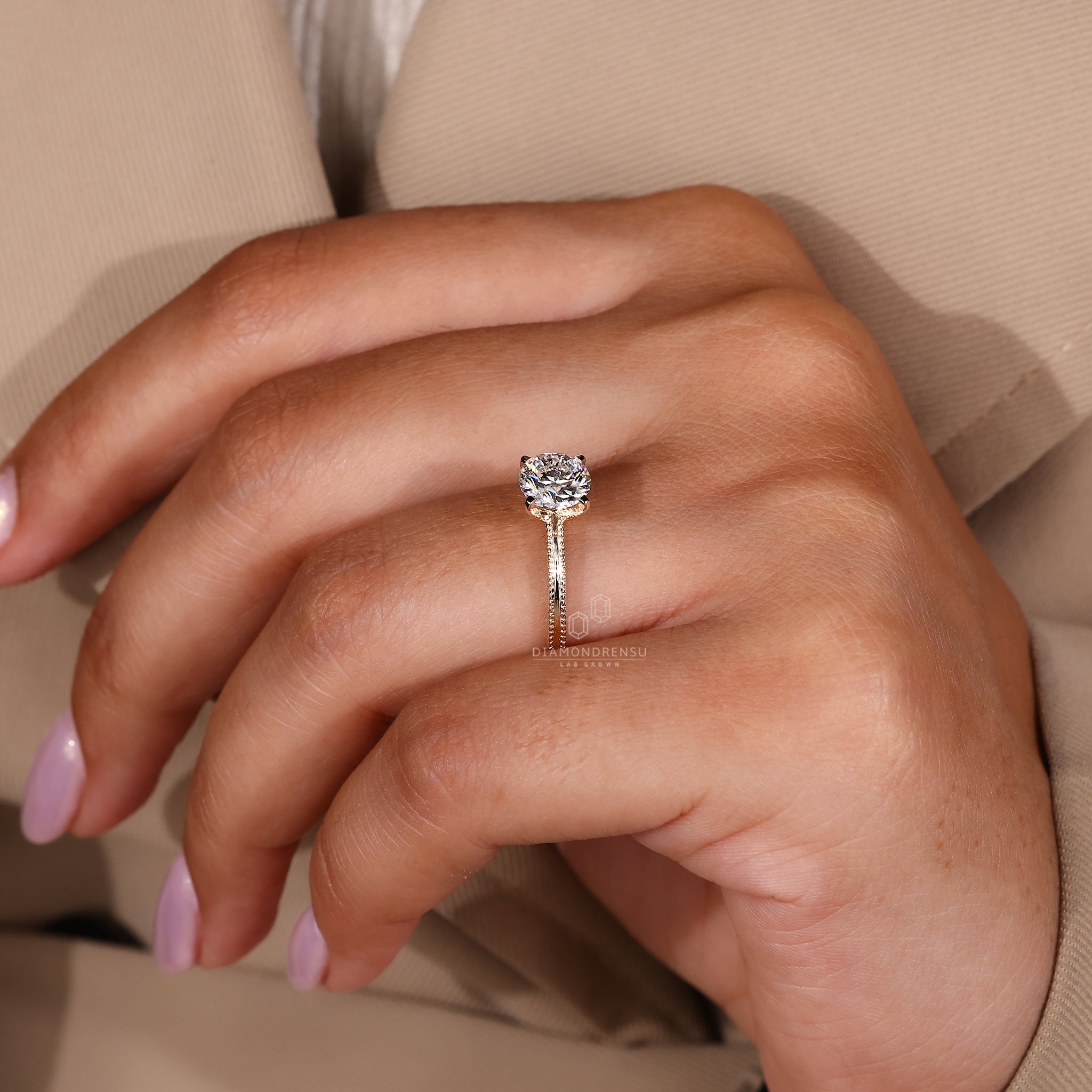 Classic yellow gold engagement ring with milgrain detail