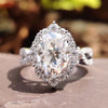 Oval halo ring with crushed ice oval cut moissanite.
