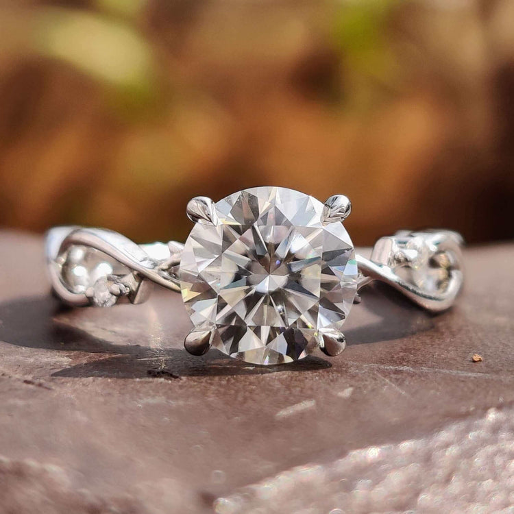 Round cut engagement ring in white gold.
