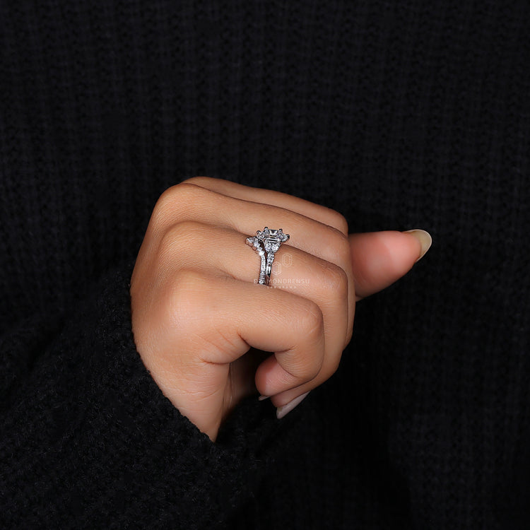 Pear and round diamond band with half eternity band style.