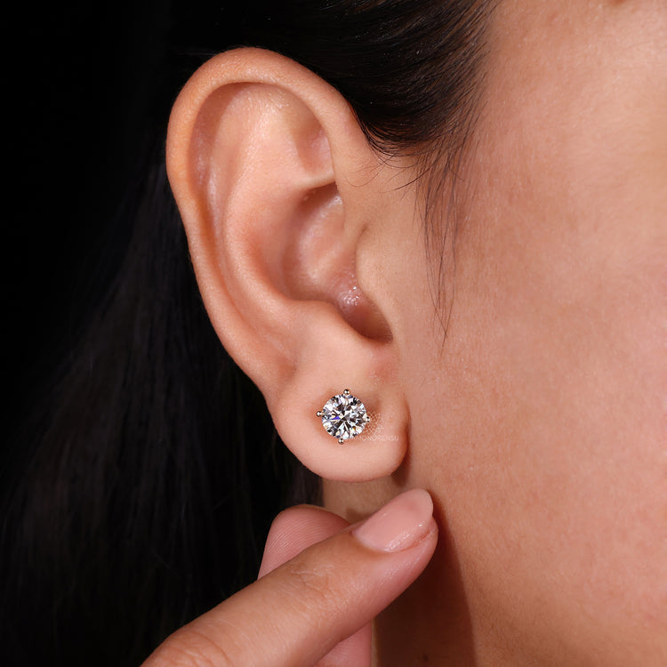 Lab grown diamond earrings set in yellow gold 4 prong settings.