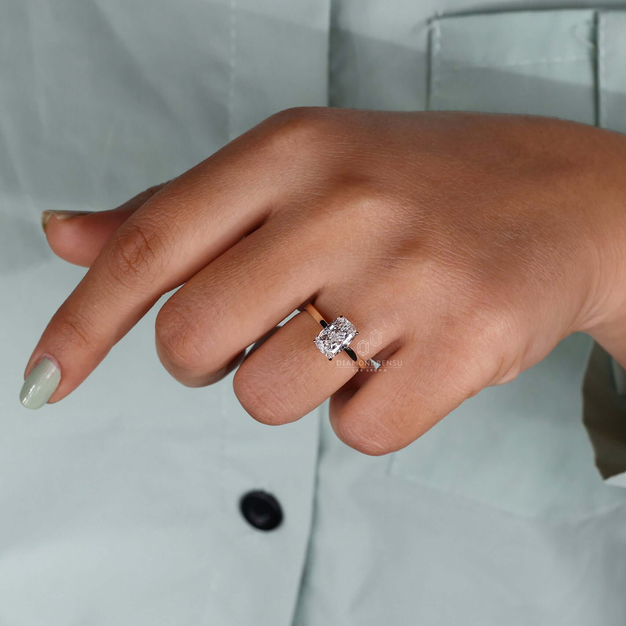 IGI certified elongated cushion cut diamond ring with a handmade finish.