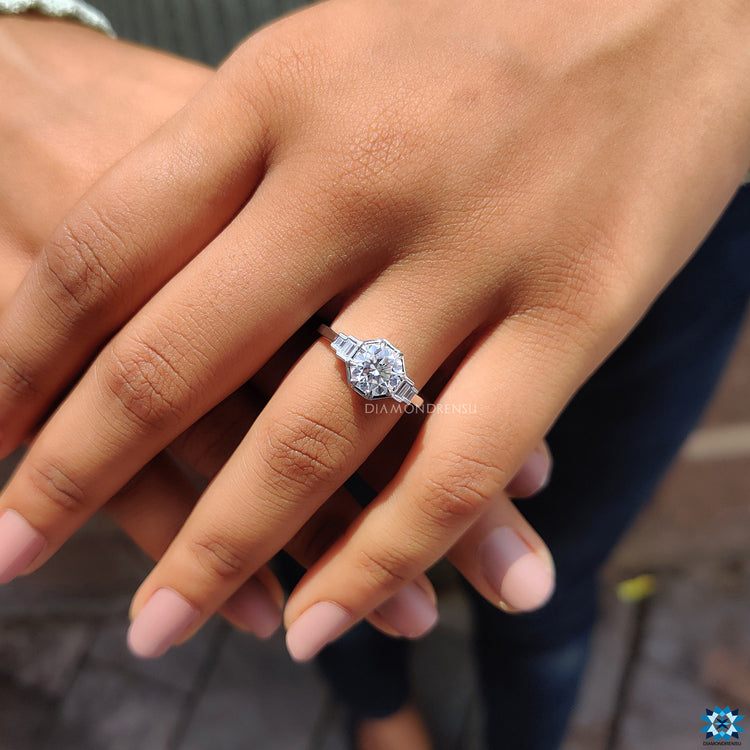 Custom engagement ring featuring moissanite and elegant baguette detail.