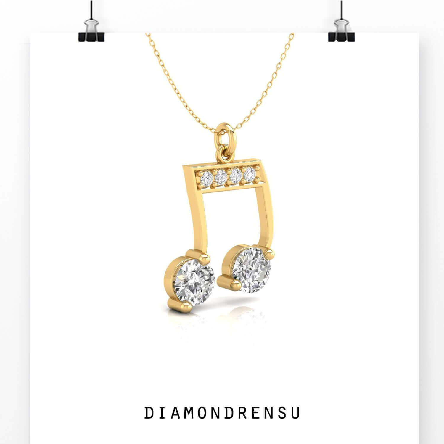 White gold pendant featuring round diamond music motif.